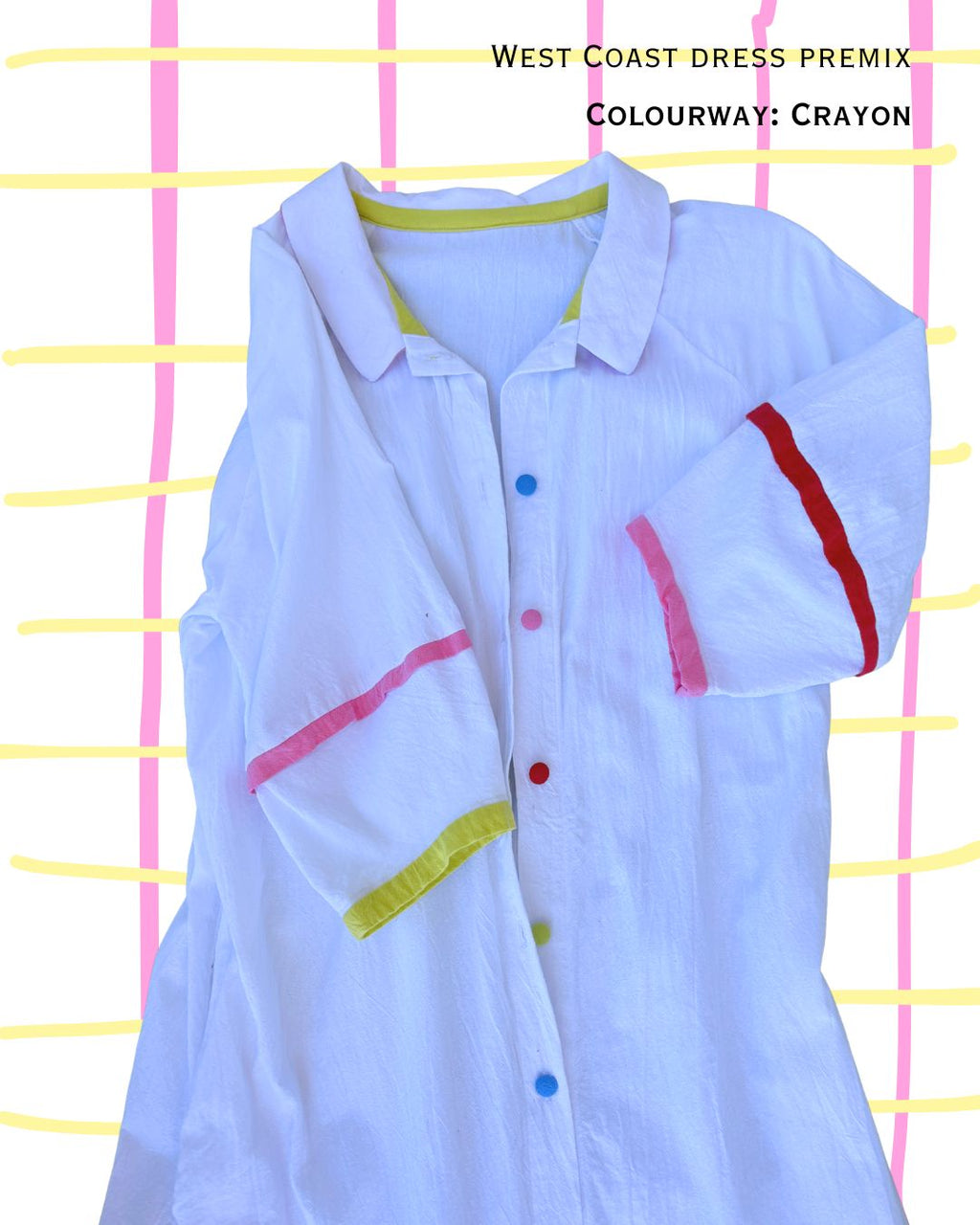 detail of white dress with colourful contrast colours in buttons and trim