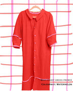 red dress with pink trim and buttons