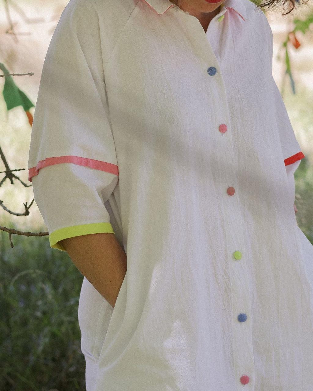 Woman wearing the Crayon west coast dress with her hands in the hidden side pockets