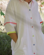 Woman wearing the Crayon west coast dress with her hands in the hidden side pockets